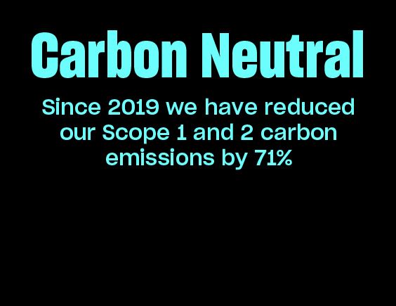 Image with black background and text stating Schuh has reduced Scope 1 and 2 emissions by 71% since 2019.