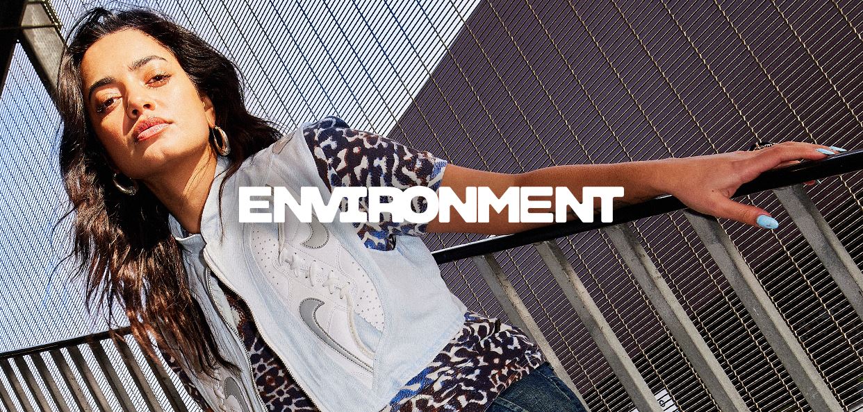 Text reads “Environment” with a person extended across the stair case