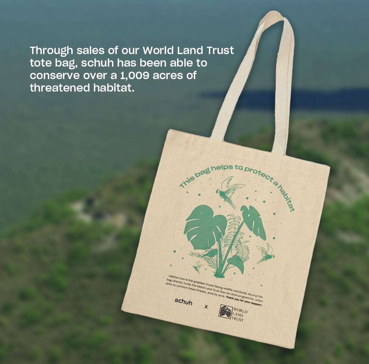 Beige tote bag with green wildlife print promoting Schuh and World Land Trust habitat conservation.