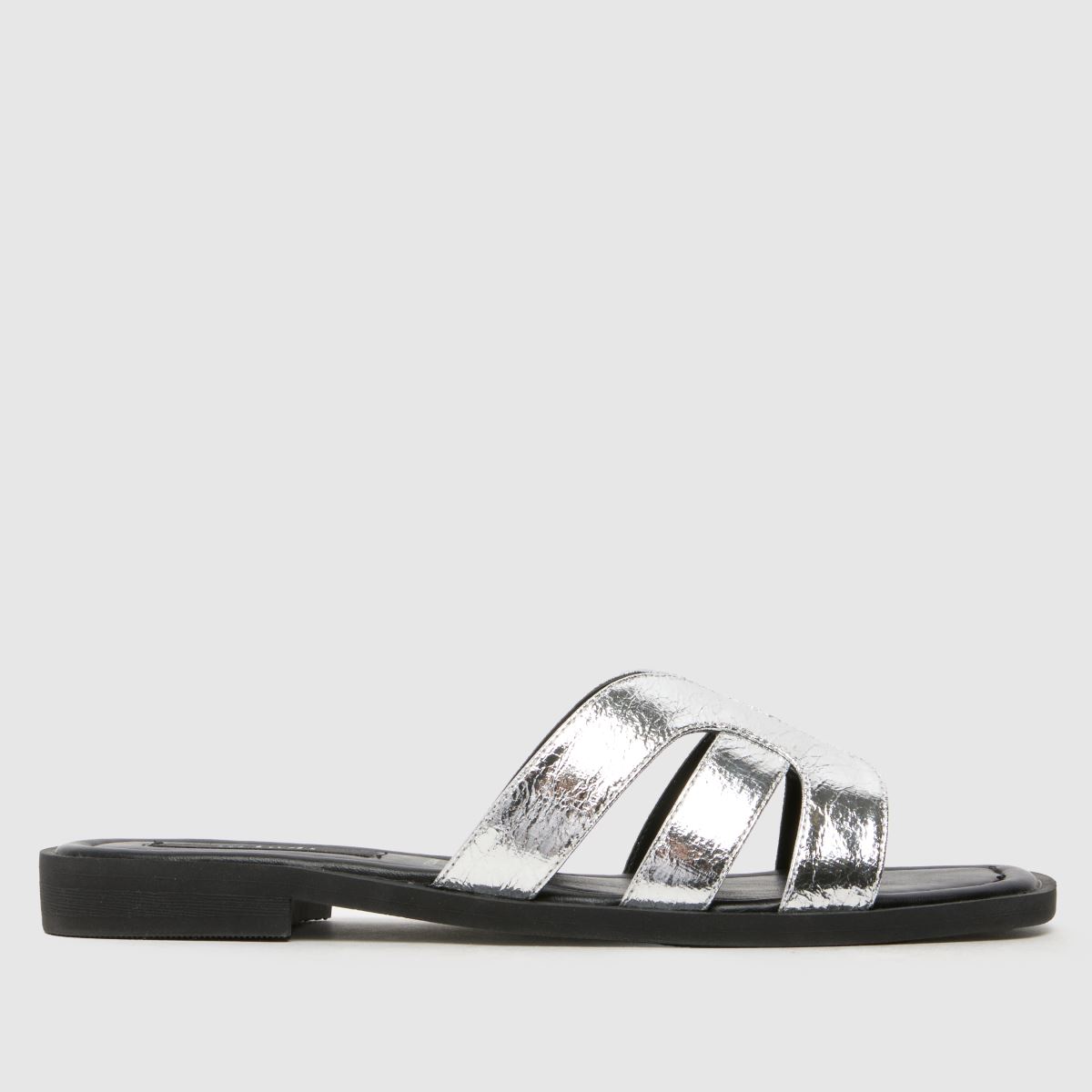 Click to view product details and reviews for Schuh Trisha Flat Mule Sandals In Silver.