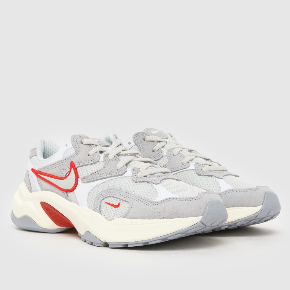 grey white and red nike shoes