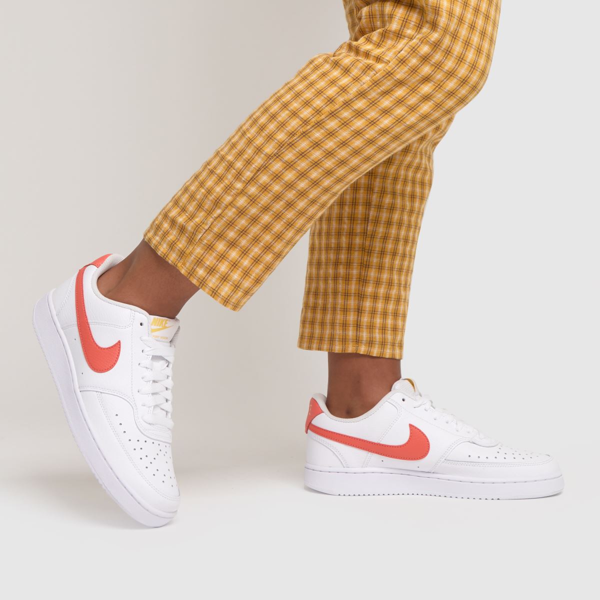 white red nike trainers