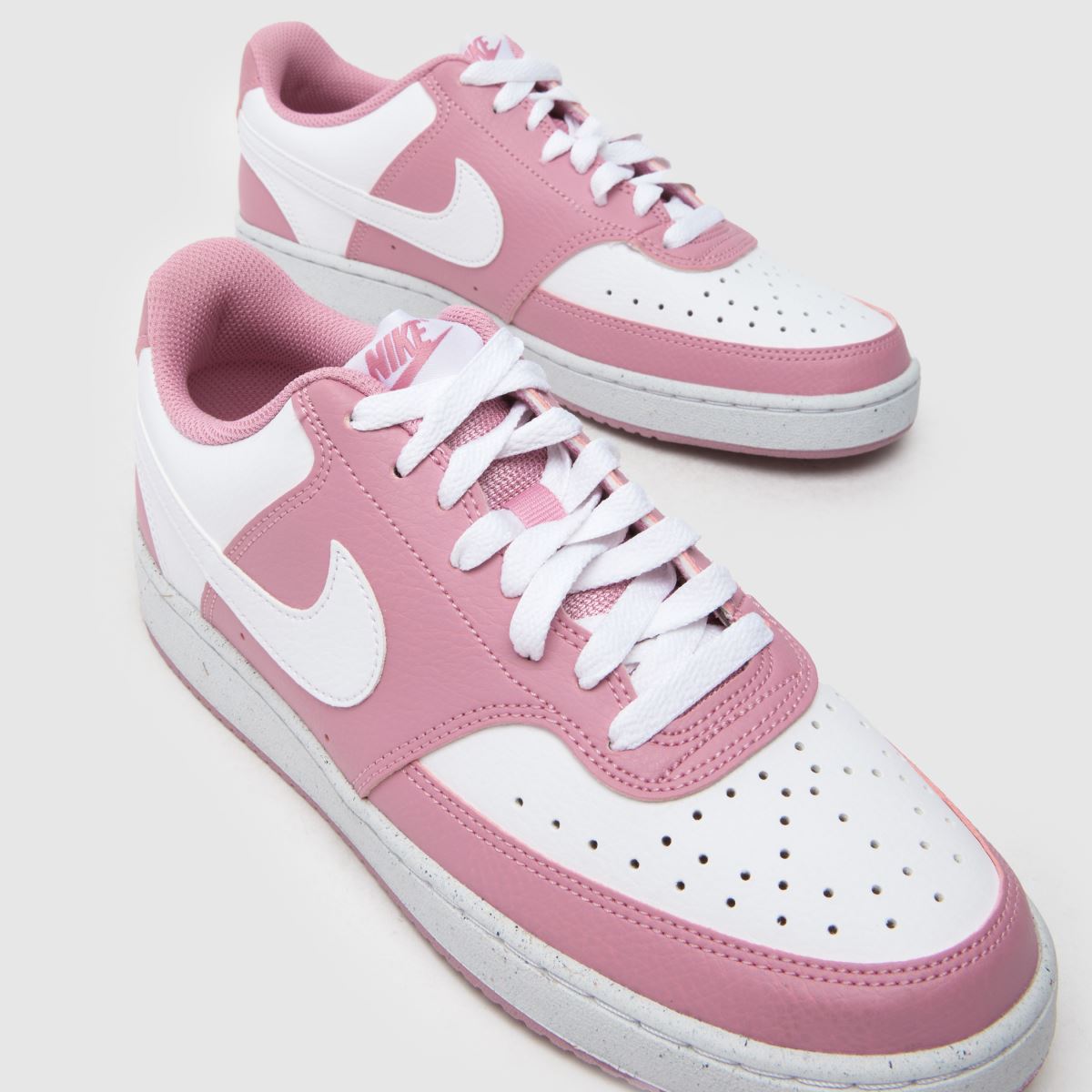white and pink court vision trainers