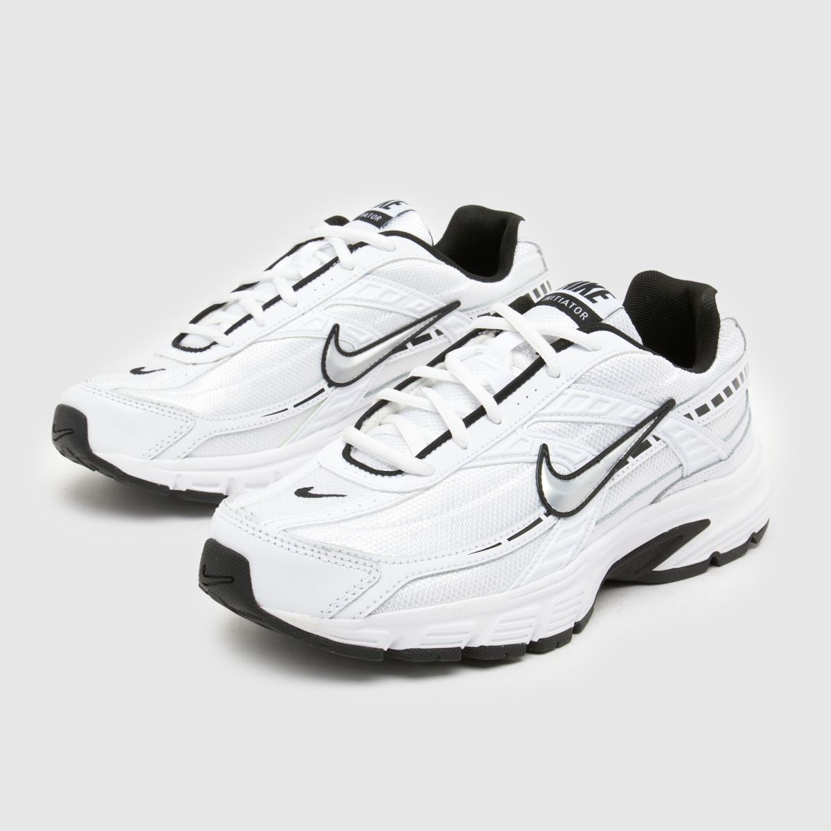 white and silver nikes
