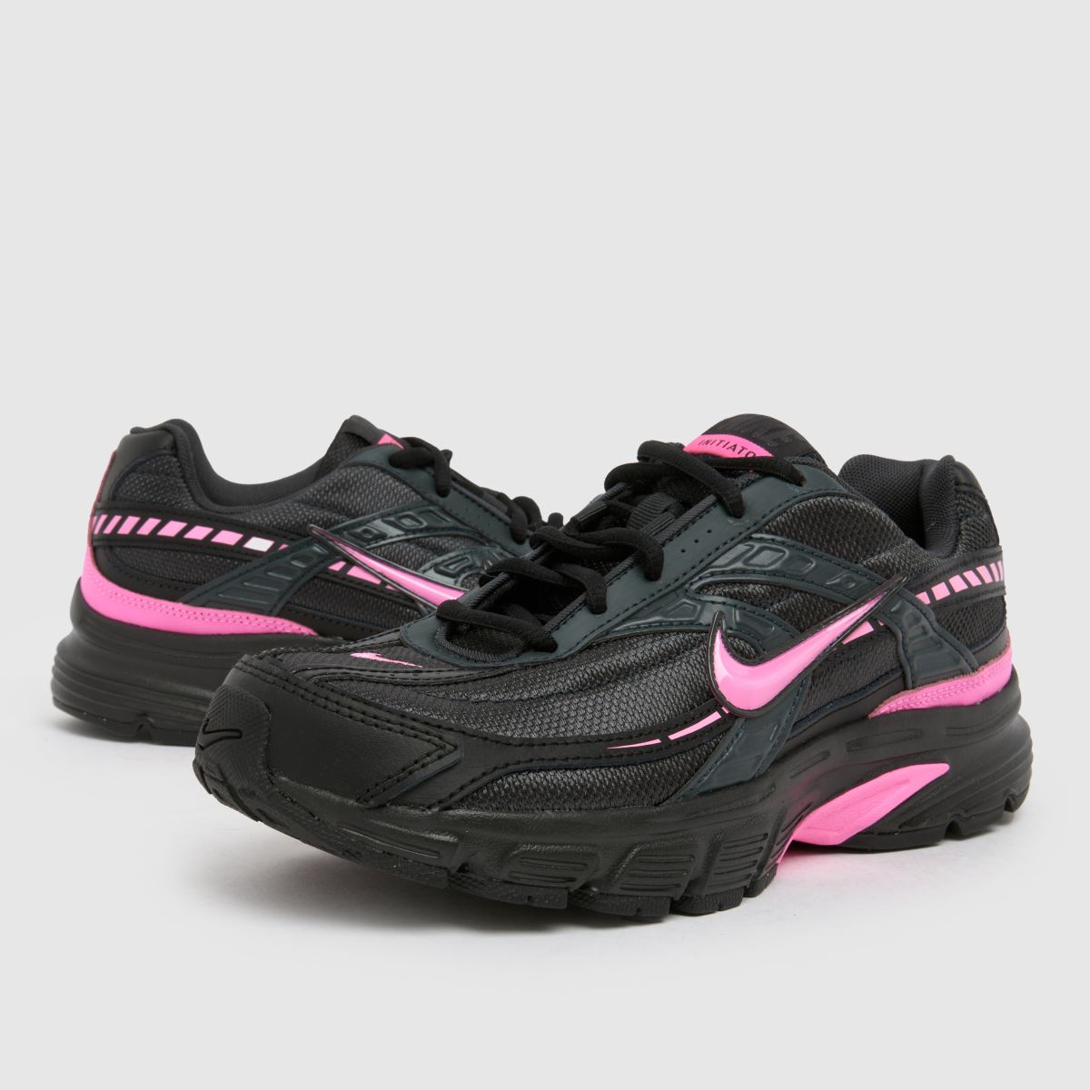 pink black nike shoes