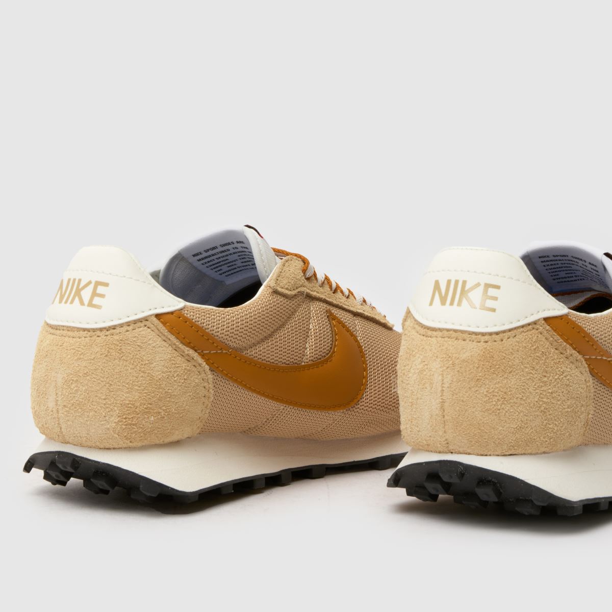 camel coloured nike trainers