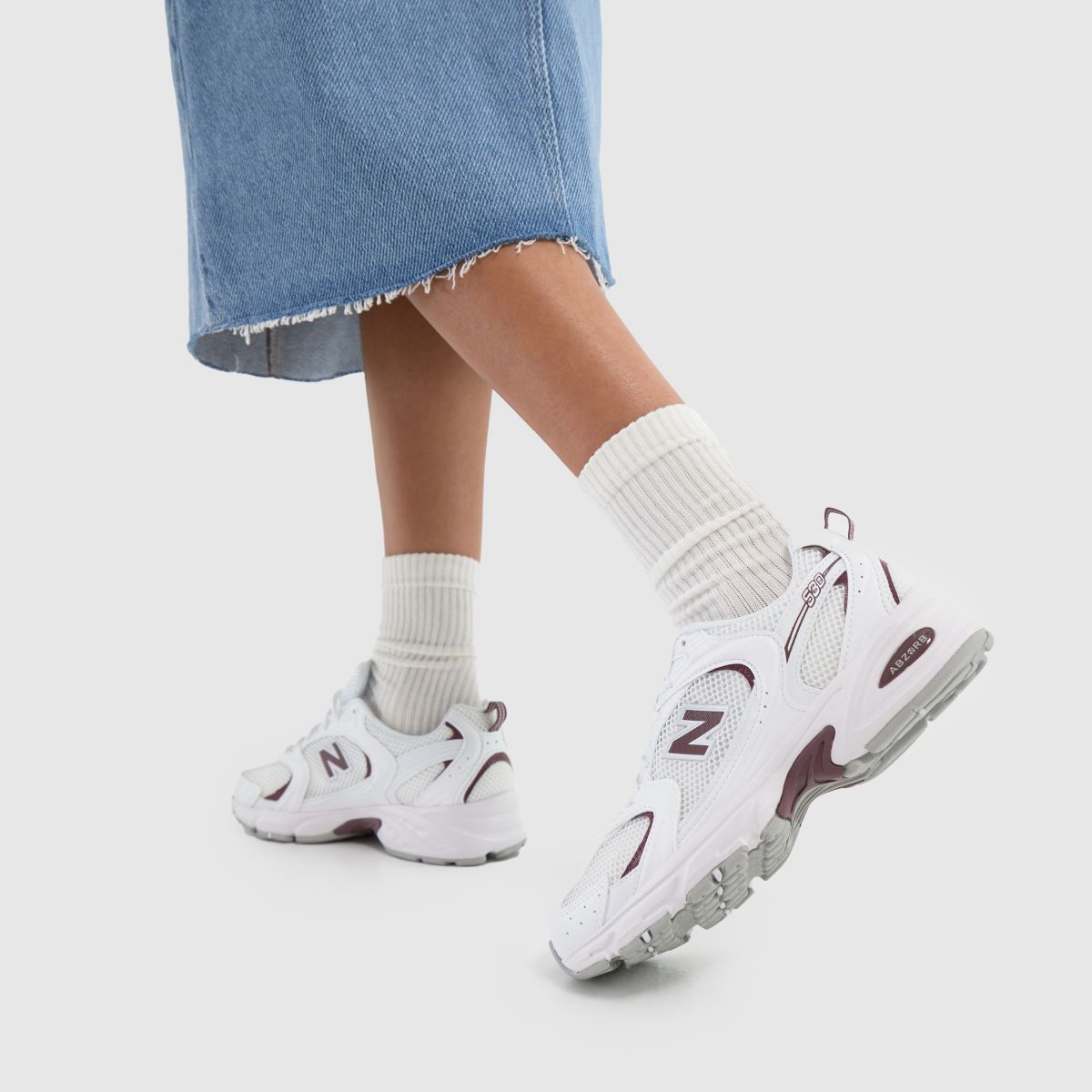 Click to view product details and reviews for New Balance 530 Trainers In White Burgundy.