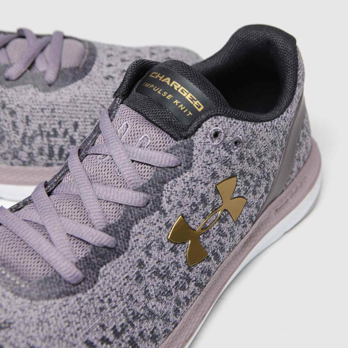 black and purple under armour shoes