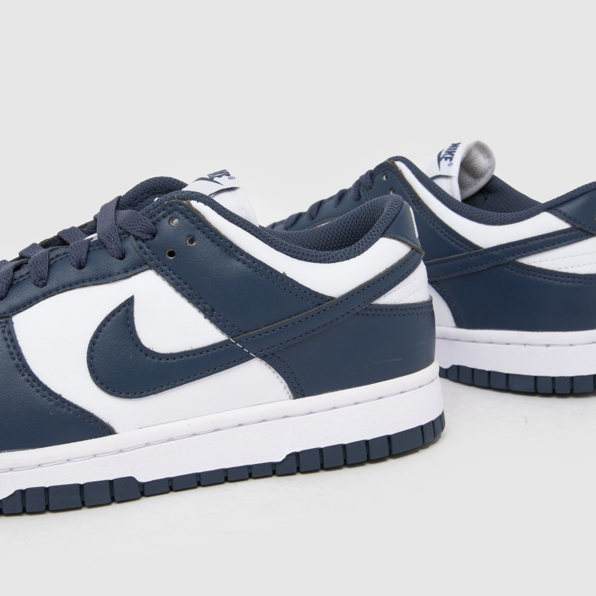 navy blue and white nikes women's