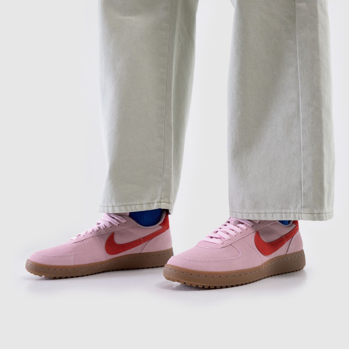 pink and red nike trainers