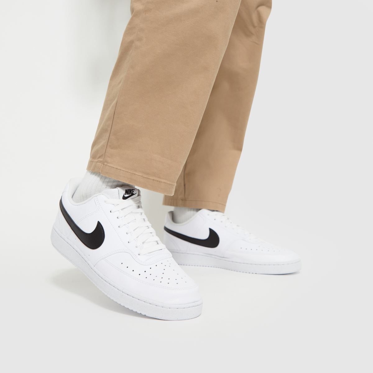 Click to view product details and reviews for Nike Mens Court Vision Low Better Trainers In White Black Logo Detail Leather Size 7.
