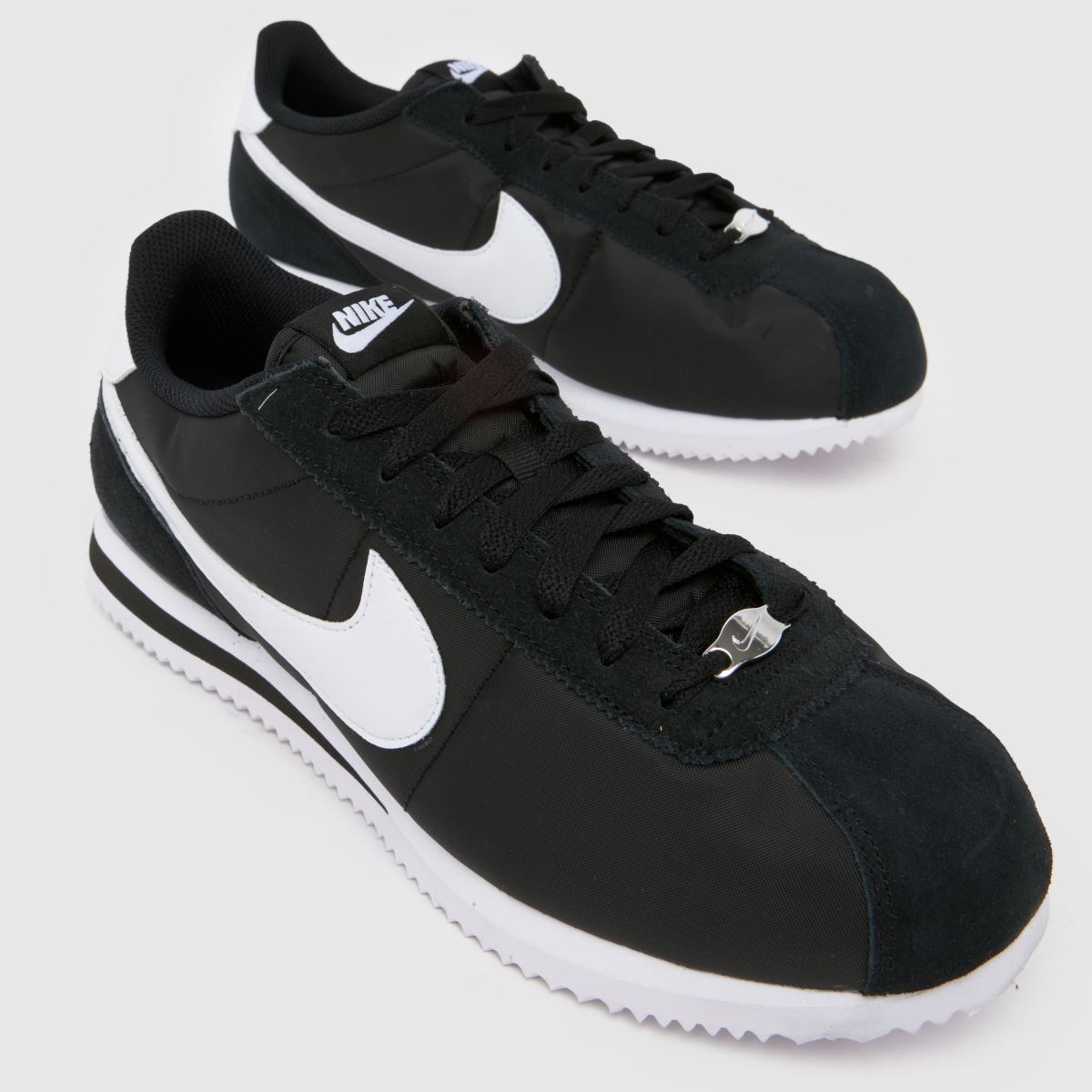 black and white cortez shoes