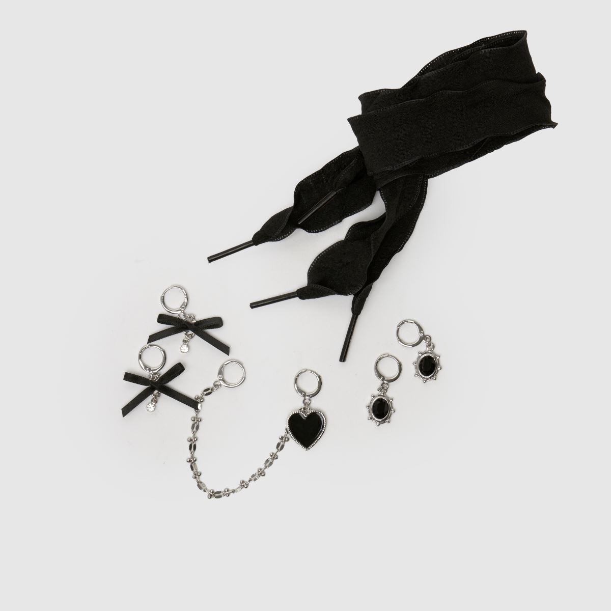 Image of Crocs Jibbitz Lace & Bow Shoe Charm Kit in Black & White